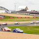 GT cars feed through the start of the race.